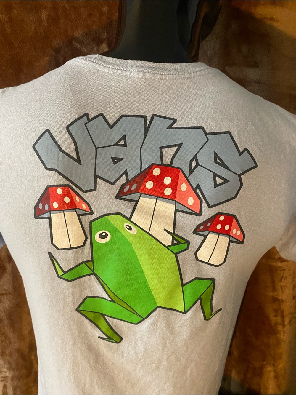 Unisex Light Blue Graphic Tee with Green Frog Logo